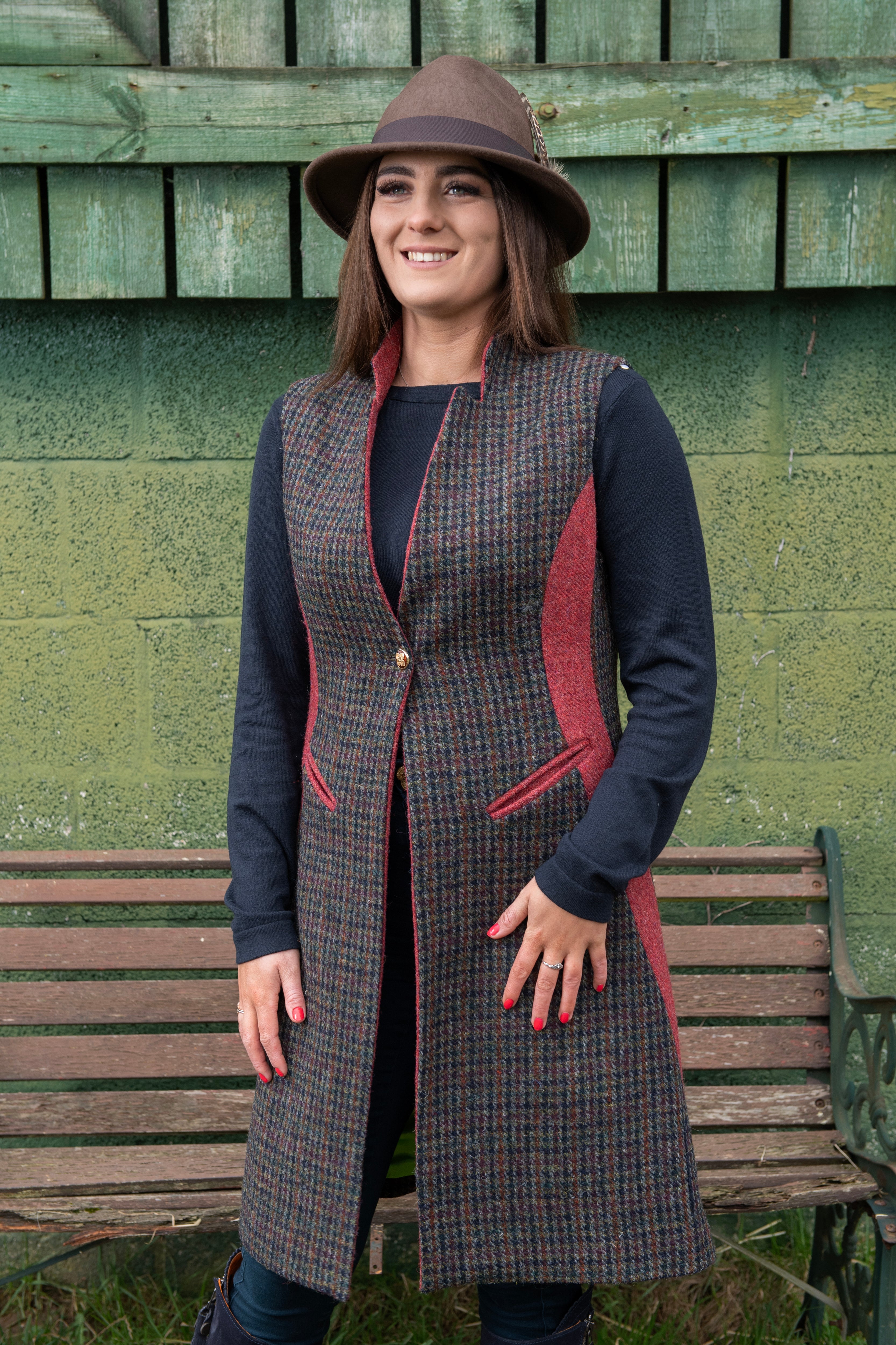 Women's tweed gilet styled with hat and boots